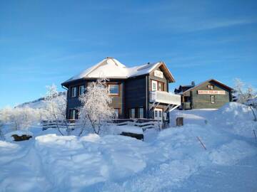 Фото Комплексы для отдыха с коттеджами/бунгало ArcticPolar Holiday Village г. Кильписъярви 1