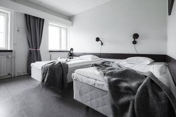 Фото номера Двухместный номер с 2 отдельными кроватями Отель Lapland Hotels Kilpis г. Кильписъярви 11